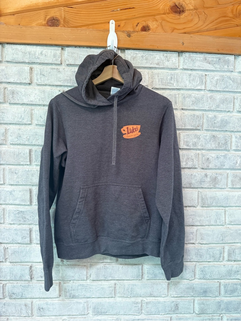 Gilmore Girls Port and Company Charcoal Hoodie with Orange Luke's Chest Logo